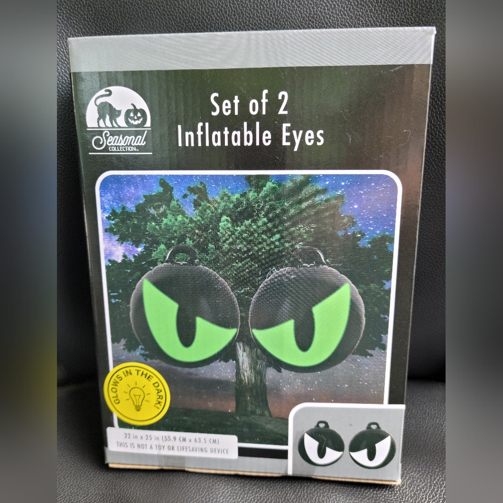 NIB set of 2 Mean looking Inflatable Eyes that Glow in the Dark